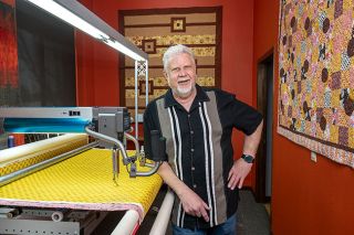 Rusty Rae/News-Register##Jack Boersma, who marks his 50th anniversary of ownership of Boersma’s Sewing Center on April 1, talks about one of the long-arm quilting machines he sells, installs and teaches to quilting enthusiasts. He is the No. 1 dealer in long-arm machines in the world, he said. Boersma’s devotes 2,200 square feet to quilting fabric — cotton cloth with colorful, often whimsical designs. Rusty Rae/News-Register##Jack Boersma, who marks his 50th anniversary of ownership of Boersma’s Sewing Center on April 1, talks about one of the long-arm quilting machines he sells, installs and teaches to quilting enthusiasts. He is the No. 1 dealer in long-arm machines in the world, he said. Boersma’s devotes 2,200 square feet to quilting fabric — cotton cloth with colorful, often whimsical designs.