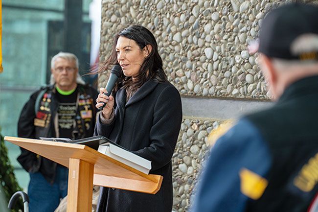 Rachel Thompson/News-Register##Lucetta Elmer of McMinnville honors veterans in attendance in her remarks at the traveling wall ceremony at Evergreen. Rachel Thompson/News-Register##Lucetta Elmer of McMinnville honors veterans in attendance in her remarks at the traveling wall ceremony at Evergreen.