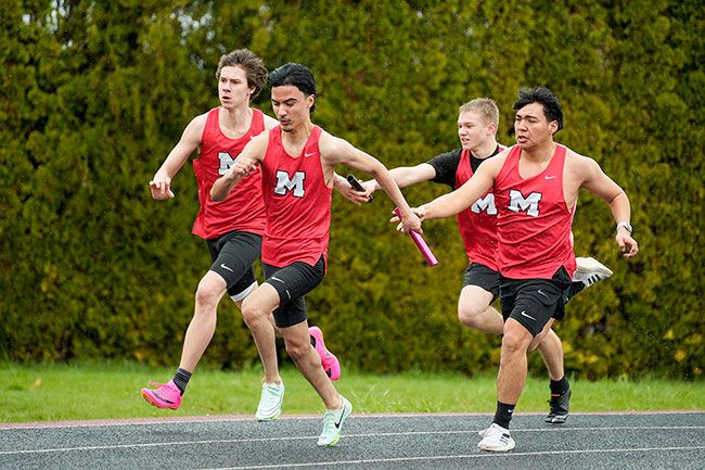 Rachel Thompson/News-Register##Julian Galvan takes the baton in a hand-off from Alex Grimaldo to run the third lap of the 4x100 relay for Mac High. Beside them, Liam Bergum passes the baton to Colton Maxwell during a meet earlier this season. Rachel Thompson/News-Register##Julian Galvan takes the baton in a hand-off from Alex Grimaldo to run the third lap of the 4x100 relay for Mac High. Beside them, Liam Bergum passes the baton to Colton Maxwell during a meet earlier this season.