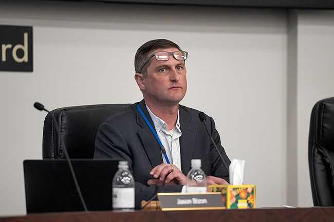 Rusty Rae/News-Register##School Board Chairman Jason Bizon listens to discussion about whether the superintendent’s contract should be ended. He and board member Abbie Warmbier supported keeping her, but the other five directors voted to approve a separation agreement in which she will be terminated as soon as her leave ends. Rusty Rae/News-Register##School Board Chairman Jason Bizon listens to discussion about whether the superintendent’s contract should be ended. He and board member Abbie Warmbier supported keeping her, but the other five directors voted to approve a separation agreement in which she will be terminated as soon as her leave ends.