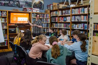 Rachel Thompson/News-Register##Comic artist and illustrator Garrett Ley leads a workshop on character creation and four-panel comic design for pre-teen students during Free Comic Book Day at the Willamina Library on Saturday.