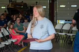 Emily Bonsant/News-Register##Yamhill Carlton High School junior Annie Featherston receives her Firefighter I certificate May 6 in Dayton, becoming the third generation of her family to serve in the Yamhill Fire Protective District. Emily Bonsant/News-Register##Yamhill Carlton High School junior Annie Featherston receives her Firefighter I certificate May 6 in Dayton, becoming the third generation of her family to serve in the Yamhill Fire Protective District.
