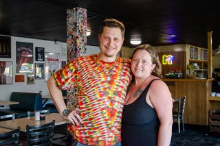 Rachel Thompson/News-Register##Marty and Melissa Rima are excited about moving from their Hangry’s food truck to the former Tommy’s restaurant location. The building has been repainted in Hangry’s signature red and decorated inside with ’80s and ’90s posters from movies, bands and cartoons. Rachel Thompson/News-Register##Marty and Melissa Rima are excited about moving from their Hangry’s food truck to the former Tommy’s restaurant location. The building has been repainted in Hangry’s signature red and decorated inside with ’80s and ’90s posters from movies, bands and cartoons.