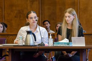Rachel Thompson/News-Register##McKenna Davidson, right, plays the murder suspect and Emily Fletcher her defense attorney in McMinnville High School’s mock trial in a real Yamhill County courtroom on May 9. The two seniors are in the school’s criminal justice pathway, and they conceived of and wrote the trial as part of their internship class. Rachel Thompson/News-Register##McKenna Davidson, right, plays the murder suspect and Emily Fletcher her defense attorney in McMinnville High School’s mock trial in a real Yamhill County courtroom on May 9. The two seniors are in the school’s criminal justice pathway, and they conceived of and wrote the trial as part of their internship class.