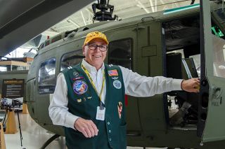 Rachel Thompson/News-Register##Barry Brown, a retired Army and National Guard helicopter pilot, stands beside the UH-1 Huey he flew during his service with the Oregon Air Guard. Now a docent at the Evergreen Aviation Museum in McMinnville, Brown is helping restore the very same aircraft. Rachel Thompson/News-Register##Barry Brown, a retired Army and National Guard helicopter pilot, stands beside the UH-1 Huey he flew during his service with the Oregon Air Guard. Now a docent at the Evergreen Aviation Museum in McMinnville, Brown is helping restore the very same aircraft.