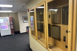 Kirby Neumann-Rea/News-Register##Names are on display in the case in Linfield’s Riley Campus Center, with space for at least one “missing” plaque.