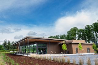 Rusty Rae/News-Register##The Evergreen Event Center features big windows that look over the vineyard on the north side of the campus. Fifty acres are planted in grapes, with another 50 planned this year. Rusty Rae/News-Register##The Evergreen Event Center features big windows that look over the vineyard on the north side of the campus. Fifty acres are planted in grapes, with another 50 planned this year.