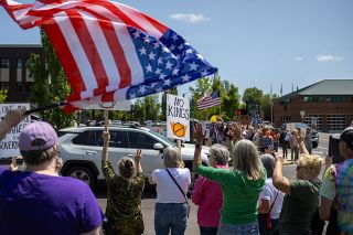 Rachel Thompson/News-Register##Protesters gather outside the McMinnville Public Library at on June 14, for the No Kings protest in opposition to President Donald Trump and his policies. Rachel Thompson/News-Register##Protesters gather outside the McMinnville Public Library at on June 14, for the No Kings protest in opposition to President Donald Trump and his policies.
