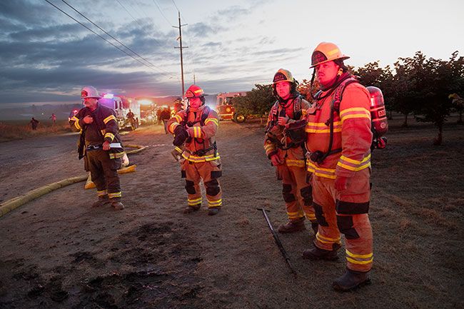 Rusty Rae/News-Register##Wind and a lack of water at the scene complicated the incident. Firefighters from numerous area agencies responded. Rusty Rae/News-Register##Wind and a lack of water at the scene complicated the incident. Firefighters from numerous area agencies responded.