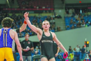 Devin Huston after winning his semifinal match at this year’s state tournament. Huston said he never planned on going to college, but his success on the mat motivated him to consider a wrestling career beyond high school. 
Rachel Thompson/News-Register file photo