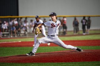 Tyler Brummit throws a fastball (shown by his grip on the baseball) during McMinnville’s quarterfinal varsity baseball game against South Medford at Patton Middle School on May 30. Mac won the game 5-4, and Brummit pitched six and 1/3 four-hit innings while striking  out two batters and allowing four runs. He is expected to be a major part of the Grizzlies’ rotation in spring 2026.
Rusty Rae/News-Register file photo