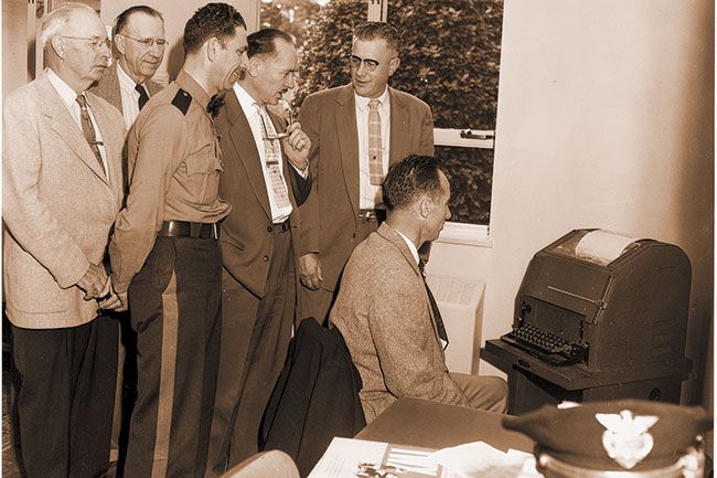 News-Register file photo##(July 5, 1955) Information on criminal activities will be spread throughout Oregon from this teletypewriting unit set up last week in the Yamhill County Sheriff’s Department. Members of the Yamhill County Court and law enforcement officers view the machine being demonstrated by Yamhill County Sheriff, W.J. Jones. News-Register file photo##(July 5, 1955) Information on criminal activities will be spread throughout Oregon from this teletypewriting unit set up last week in the Yamhill County Sheriff’s Department. Members of the Yamhill County Court and law enforcement officers view the machine being demonstrated by Yamhill County Sheriff, W.J. Jones.