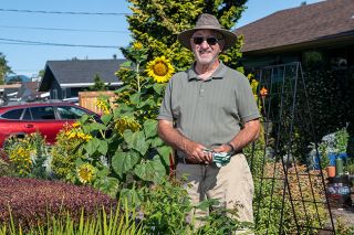 Rusty Rae/News-Register##Rich Pruitt enjoys making his yard a place for wildlife, especially birds – and the birds help out by planting things such as the large sunflowers that are a focal point in front of his home. Pruitt is retired from Patton Middle School, where he taught sixth grade. The McMinnville Garden Club chose his front garden at 927 N.E. 18th St. as its Yard of the Month for July. The yard features a variety of flowers and foliage, most of which are perennials. Rusty Rae/News-Register##Rich Pruitt enjoys making his yard a place for wildlife, especially birds – and the birds help out by planting things such as the large sunflowers that are a focal point in front of his home. Pruitt is retired from Patton Middle School, where he taught sixth grade. The McMinnville Garden Club chose his front garden at 927 N.E. 18th St. as its Yard of the Month for July. The yard features a variety of flowers and foliage, most of which are perennials.