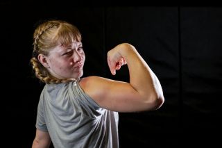 Zoe Brewer poses for a photo after a wrestling practice session at the WHS wrestling room. Rusty Rae/News-Register