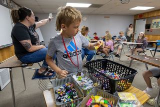 Rachel Thompson/News-Register##Braxton Langley chooses candy for his award after winning camp vocabulary bingo. Elementary students learn word recognition as part of the Faulconer-Chapman School summer literacy camp. Rachel Thompson/News-Register##Braxton Langley chooses candy for his award after winning camp vocabulary bingo. Elementary students learn word recognition as part of the Faulconer-Chapman School summer literacy camp.