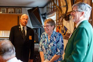 Rachel Thompson/News-Register##Patty Fries, center, a volunteer with the Saturday Morning Breakfast program, accepts a $200 check for the program from the Benevolent and Protective Order of Elks, McMinnville Lodge 1283. Vern Popowski, esquire with the Elks, left, and Joe Hicke, exalted ruler, presented the fund to help the nonprofit organization continue its mission of feeding people in need. Saturday Morning Breakfast feeds 250 to 400 people a week who are homeless, seniors or members of families just getting by despite working multiple jobs. The program is on hiatus this month as board members determine how to raise funds from the community and deal with federal cuts that have reduced food availability.