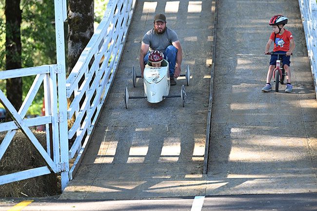 Rusty Rae/News-Register##Eight-year-old Ben Blatner of Yamhill takes his first test run on the derby ramp Tuesday night with the help of his crew chief, and father, David. After getting used to the downhill track with a couple of short runs, Ben made several from the start gate at the top. This will be Ben’s first year in the derby. Rusty Rae/News-Register##Eight-year-old Ben Blatner of Yamhill takes his first test run on the derby ramp Tuesday night with the help of his crew chief, and father, David. After getting used to the downhill track with a couple of short runs, Ben made several from the start gate at the top. This will be Ben’s first year in the derby.