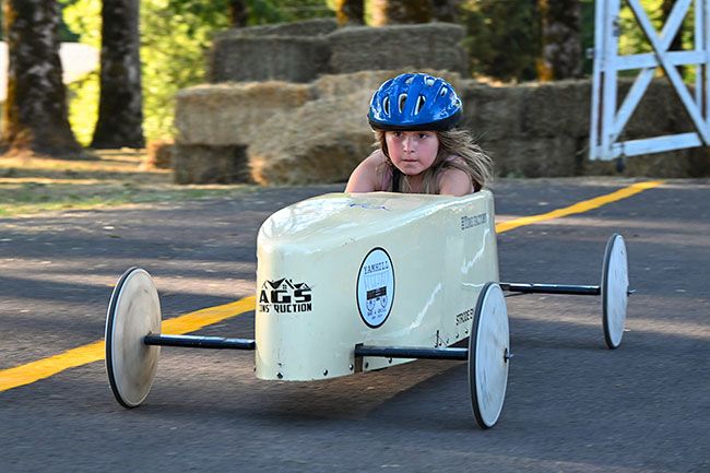 Rusty Rae/News-Register##Also entering her first derby is 8-year-old Emma Womack, shown here with eyes focused on the finish line as her car travels through the bottom section of the race course. Rusty Rae/News-Register##Also entering her first derby is 8-year-old Emma Womack, shown here with eyes focused on the finish line as her car travels through the bottom section of the race course.