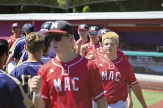 Mac-Willamette Valley Orthopedics and Sports Medicine players exchange high-fives with opponents from Grant Generals Baseball 18U after Mac’s 10-0 victory at Jim Wright Stadium on Roy Helser Field during the Mac Premier Tournament on July 12. Mac went 3-1 and was crowned tournament champions over Bridge City Baseball. Their prize was $400 worth of high school legal baseballs.
Nathan Ecker/News-Register
