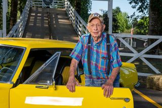 Rusty Rae/News-Register##Charlie Bauer, who grew up in Yamhill, stands beside a 1967 Camaro parked in front of the derby ramp in Beulah Park. The car belongs to his friend, Nick Mccleskey, with whom Bauer shares a passion for classic vehicles. Rusty Rae/News-Register##Charlie Bauer, who grew up in Yamhill, stands beside a 1967 Camaro parked in front of the derby ramp in Beulah Park. The car belongs to his friend, Nick Mccleskey, with whom Bauer shares a passion for classic vehicles.