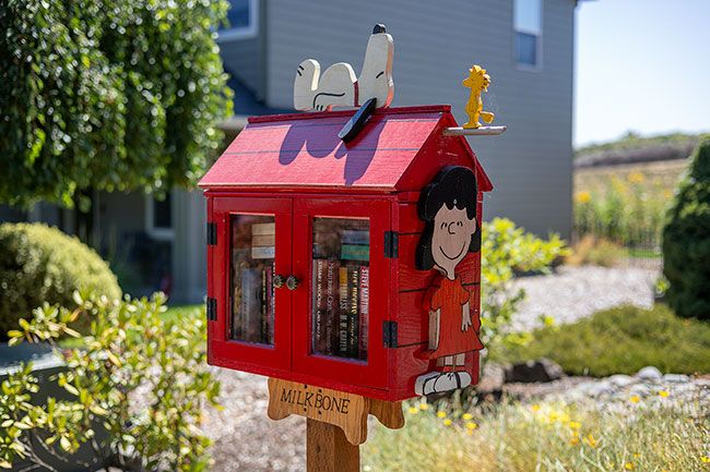 Rachel Thompson/News-Register##The Wallicks’ “Peanuts”-inspired Little Free Library was decorated by a friend. Rachel Thompson/News-Register##The Wallicks’ “Peanuts”-inspired Little Free Library was decorated by a friend.