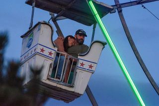 Rachel Thompson/News-Register##Amy Yates of McMinnville rests her head on Jack Makin of Molalla as they ride the Ferris wheel Saturday evening at the Yamhill County Fair.