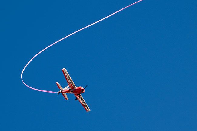 Rusty Rae/News-Register##An Edge 540 Aerobot designed for aerobatics dazzled visitors at Rock of Ages Saturday as it pulled a 50-foot streamer through the air. It was handled by veteran McMinnville pilot Russell Ucolano (pictured below) , who has been flying radio control airplanes since 1972.