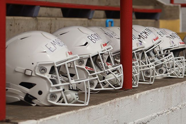 Nathan Ecker/News-Register##A line of helmets with player names sit in the grandstands at Maxwell Field. Linfield captured the Northwest Conference title in 2024, going 10-2, but fell short of a Division III championship when they lost to Mary Hardin-Baylor in the second round of play. The Wildcats blew away their conference competition en route to their conference title, leading the NWC during league play in passing yards (3784), touchdowns (37), defensive interceptions (23) and rushing yards (1987).