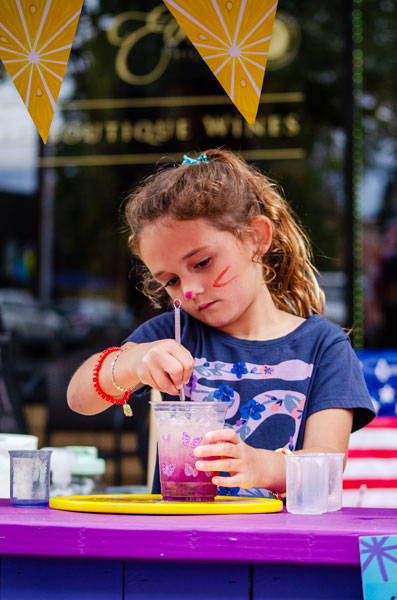 Rachel Thompson/News-Register##“It changes color with the lemon so it turns purple,” explains 6-year-old Silver Thomas as she stirs butterfly pea flower concentrate into her lemonade. Rachel Thompson/News-Register##“It changes color with the lemon so it turns purple,” explains 6-year-old Silver Thomas as she stirs butterfly pea flower concentrate into her lemonade.
