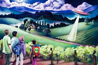 Submitted photo##A customized UFO-themed mural is one of the features of the newly remodeled McMinnville Walmart. Company officials said the store now has larger selection of food products and a pharmacy area twice the size it was previously. Submitted photo##A customized UFO-themed mural is one of the features of the newly remodeled McMinnville Walmart. Company officials said the store now has larger selection of food products and a pharmacy area twice the size it was previously.