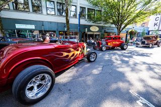 Rachel Thompson/News-Register##Drivers in flame-painted hot rods rumble past spectators Saturday evening as the “dragging the gut” portion of Cruising McMInnville begins. Rachel Thompson/News-Register##Drivers in flame-painted hot rods rumble past spectators Saturday evening as the “dragging the gut” portion of Cruising McMInnville begins.