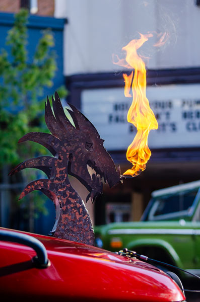 Rachel Thompson/News-Register##A flame-shooting dragon draws attention to the Fire Gambler, a heavily modified Nissan Pathfinder out of Portland, during the evening’s cruise. Rachel Thompson/News-Register##A flame-shooting dragon draws attention to the Fire Gambler, a heavily modified Nissan Pathfinder out of Portland, during the evening’s cruise.