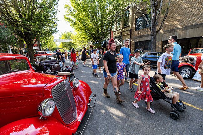 Rachel Thompson/News-Register##Crowds weave through rows of vintage cars on Third Street during Saturday’s Cruising McMinnville, a daylong celebration of classic cars and the local tradition of “dragging the gut.” Rachel Thompson/News-Register##Crowds weave through rows of vintage cars on Third Street during Saturday’s Cruising McMinnville, a daylong celebration of classic cars and the local tradition of “dragging the gut.”