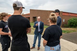 Rusty Rae/News-Register##New Willamina Principal Jeremy Hurl chats with senior members of the wrestling team Tuesday before the start of class. From left are Kisor Savage, Warren Reed, Paige Baker and Hunter Mendenhall. Increasing student engagement is one of Hurl’s priorities this year. Rusty Rae/News-Register##New Willamina Principal Jeremy Hurl chats with senior members of the wrestling team Tuesday before the start of class. From left are Kisor Savage, Warren Reed, Paige Baker and Hunter Mendenhall. Increasing student engagement is one of Hurl’s priorities this year.