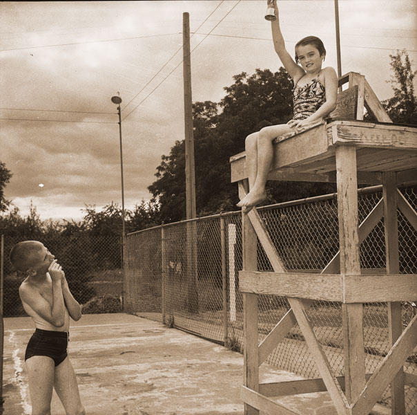 ## (Aug. 25, 1955) Betsy Skelly holds the cup she won for being named the outstanding girl swimmer in the Tuesday water carnival held at the McMinnville pool.
