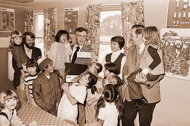 ##(Aug. 29, 1975) County commissioners were at Yamhill County Child Development Center this week to deliver a federal revenue sharing check to Director Sharon Swain to finance the center’s summer Latch Key program. Friday is last day for the program, which provided daycare for school age children such as those pictured above. The money was recommended by Yamhill County Social Service Advisory Committee, which now is doing a study concerning citywide need for before and after school Latch Key during the school year. Pictured handing over the check to Mrs. Swain is Commissioner Colin Armstrong. At left is Bruce Bartow, co-chairman of the social service committee; at right is commissioner Ted Lopuszynski.