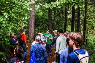 Friends of Chehalem Trails photo##Friends of Chehalem Trails president Matt Dolphin, center, talks with some of the 50 volunteer who showed up Aug. 16 to help restore trails at Bob and Crystal Rilee Park, west of Newberg on Parrett Mountain.