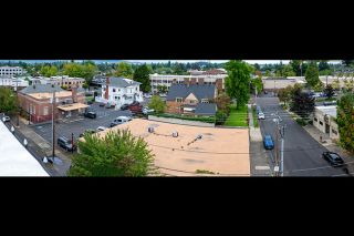 Rusty Rae/News-Register##Four county-owned buildings will be listed for sale together for $5.5 million. They are the one-story former planning department building, front center, and three historic buildings,  left to right — the county clerk’s office (Old Post Office), commissioners’ office (Frank Fenton House) and the former county finance building (Jack Spence Building). Far right is the county’s former public health building which currently has several offers for purchase.
