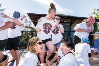 News-Register file photo##During the Carlton Crush grape-stomping competition in 2021, Grape Gatsby team members react as grape juice goes flying. On stage are Shelly Charles and Maggie Hill, and helping on the ground are Amy Rolle and Mary Grundon. News-Register file photo##During the Carlton Crush grape-stomping competition in 2021, Grape Gatsby team members react as grape juice goes flying. On stage are Shelly Charles and Maggie Hill, and helping on the ground are Amy Rolle and Mary Grundon.