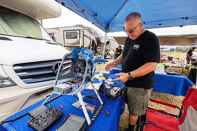 Rachel Thompson/News-Register##Bottita works on replacing the servo in the model. He said he enjoys all aspects of the radio-controlled helicopter hobby — building and maintaining the aircraft, as well as flying them. He has a dozen helicopters and several planes, as well. Rachel Thompson/News-Register##Bottita works on replacing the servo in the model. He said he enjoys all aspects of the radio-controlled helicopter hobby — building and maintaining the aircraft, as well as flying them. He has a dozen helicopters and several planes, as well.