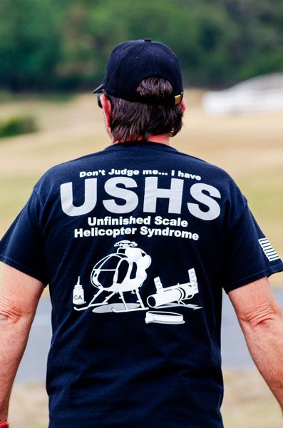 Rachel Thompson/News-Register##Scott Zumwalt of Washington sports a T-shirt that describes a common affliction among radio-controlled hobbyists who build and repair their own aircraft — unfinished scale helicopter syndrome. Rachel Thompson/News-Register##Scott Zumwalt of Washington sports a T-shirt that describes a common affliction among radio-controlled hobbyists who build and repair their own aircraft — unfinished scale helicopter syndrome.