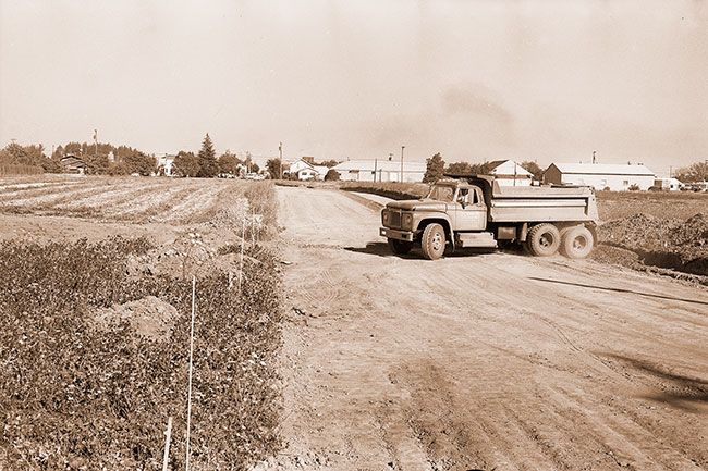 (Sept. 23, 1970) Work is progressing on the city of McMinnville’s paving project for 19th Street (off of Baker Street). Property on either side of street is owned by G.A. Nelson of McMinnville. He plans to sell lots in the area as soon as it is platted.