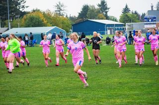 Haley Miersma runs down the field in celebration of the teams mercy rule victory on Sept. 30.##Emily Bonsant/News-Register Haley Miersma runs down the field in celebration of the teams mercy rule victory on Sept. 30.##Emily Bonsant/News-Register