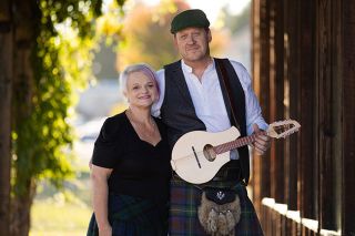 Rachel Thompson/News-Register##Jeremy Moldovan-Trujillo and his wife, Gail, who share a Celtic heritage, stand outside the VIP cabin at the Yamhill County Fairgrounds, home to McMinnville’s annual Scottish Festival. He curates the music and will perform as Jimi Sexton, while she’ll help welcome guests as a VIP area volunteer. Rachel Thompson/News-Register##Jeremy Moldovan-Trujillo and his wife, Gail, who share a Celtic heritage, stand outside the VIP cabin at the Yamhill County Fairgrounds, home to McMinnville’s annual Scottish Festival. He curates the music and will perform as Jimi Sexton, while she’ll help welcome guests as a VIP area volunteer.