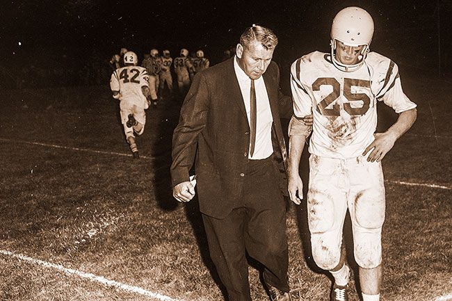 ##(Sept. 29, 1965) Dick Beathe, the Bruin end who raced 68 yards for a touchdown on the opening kickoff against Dallas Friday night, gets a few words of advice from Assistant Coach By Bender. Beathe was untouched during the course of his lengthy gallop.