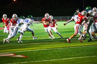 Junior Grizzly running back Riley Martin finds a hole during the Grizzlies 40-0 homecoming victory against McKay on Sept. 25 at Wortman Stadium. Martin ran for one score in the Grizzlies game against Liberty on Oct. 3.##Rusty Rae/News-Register file photo Junior Grizzly running back Riley Martin finds a hole during the Grizzlies 40-0 homecoming victory against McKay on Sept. 25 at Wortman Stadium. Martin ran for one score in the Grizzlies game against Liberty on Oct. 3.##Rusty Rae/News-Register file photo