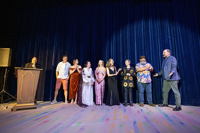 Rachel Thompson/News-Register##Guests mingle in the Gallery Theater lobby during the silent auction and cocktail hour. Judges for the evening included former Mayor Remy Drabkin, Sheriff Sam Elliott, District Attorney Kate Lynch, Yamhill County Health and Human Services Director Lindsey Manfrin, and Housing Authority Executive Director Vickie Ybarguen. Proceeds supported Henderson House’s shelter and advocacy work amid funding cuts.