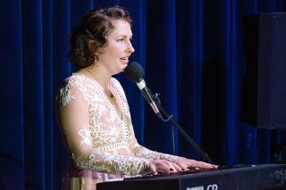 Rachel Thompson/News-Register##“This song is dedicated to all the survivors who had the strength to leave,” said contestant Amanda Farmer before performing “I Will Always Love You” during Saturday’s Crown of Yamhill County fundraiser for the Henderson House domestic violence program. Founder of Saint Bezzie’s Art Collab and a Henderson House volunteer, Farmer was later crowned the 2025 winner.