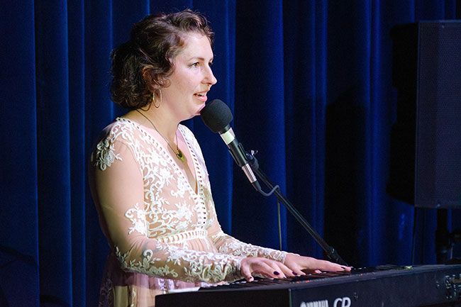 Rachel Thompson/News-Register##“This song is dedicated to all the survivors who had the strength to leave,” said contestant Amanda Farmer before performing “I Will Always Love You” during Saturday’s Crown of Yamhill County fundraiser for the Henderson House domestic violence program. Founder of Saint Bezzie’s Art Collab and a Henderson House volunteer, Farmer was later crowned the 2025 winner.