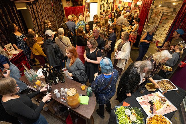 Rachel Thompson/News-Register##Emcee John Olson, president and CEO of the McMinnville Area Chamber of Commerce, introduces Crown of Yamhill County contestants. From left are Erich Berg, Emily Carlson, Amanda Farmer, Stephanie Fuchs, Debbie Harmon Ferry, James Howe, McKenzie Moorhead and Scott Parker. The pageant-style competition featured formalwear and talent rounds.